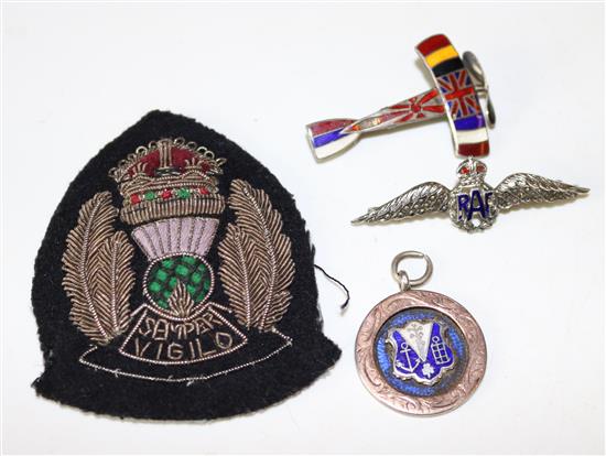 Silver and enamel aeroplane brooch, R.A.F badge and 2 other military items